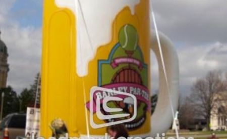 giant custom inflatable Par-Tee beer mug on parade float